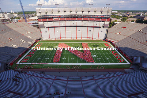 Freshman students form the N on the Memorial Stadium field for the class of 2026 photo. Tunnel Walk 