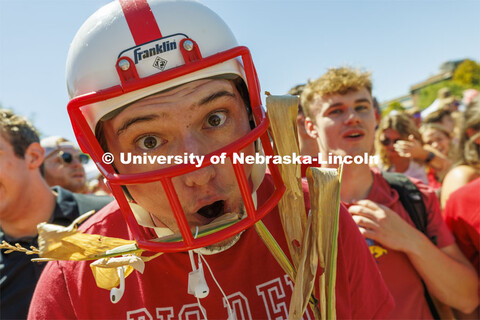 Denis McGinty, a sophomore from Chicago, suited up with a helmet and cornstalk for the game. Student
