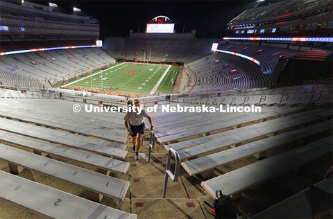 UNL Air Force cadets run up the long south stadium steps. More than 160 UNL ROTC cadets along with a