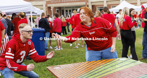 Jack Yelden, right, catches the dice as he and Thomas Ringler play beer die at the Acacia tent durin