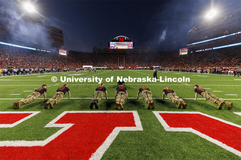 ROTC cadets and midshipmen do pushups for points after every touchdown. Nebraska vs. Georgia Souther