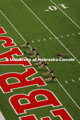 ROTC cadets and midshipmen do pushups for points after every touchdown. Nebraska vs. Georgia Souther