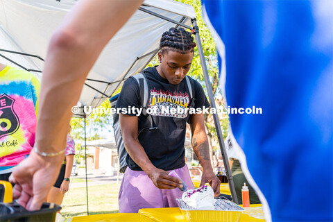 Students gathered in the Nebraska Union greenspace to tie-dye “Peace, Love, Consent” t-shirt (wh