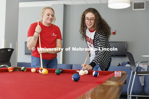 Students playing a game of pool. Housing Photo Shoot in Able Sandoz Residence Hall. September 27, 20