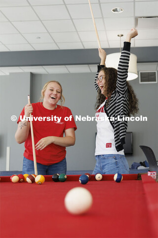 Students playing a game of pool. Housing Photo Shoot in Able Sandoz Residence Hall. September 27, 20