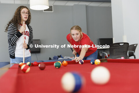 Students playing a game of pool. Housing Photo Shoot in Able Sandoz Residence Hall. September 27, 20