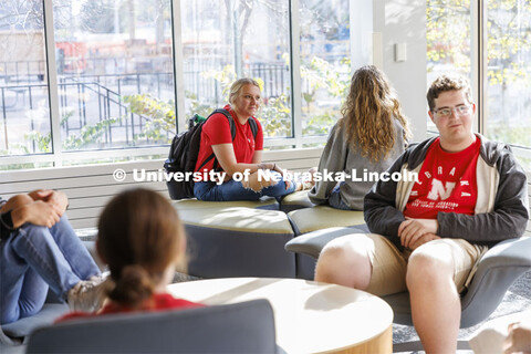 Student socializing in a commons area. Housing Photo Shoot in Able Sandoz Residence Hall. September 