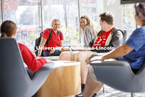 Student socializing in a commons area. Housing Photo Shoot in Able Sandoz Residence Hall. September 