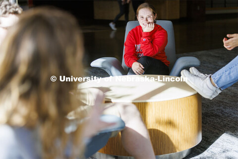 Student socializing in a commons area. Housing Photo Shoot in Able Sandoz Residence Hall. September 