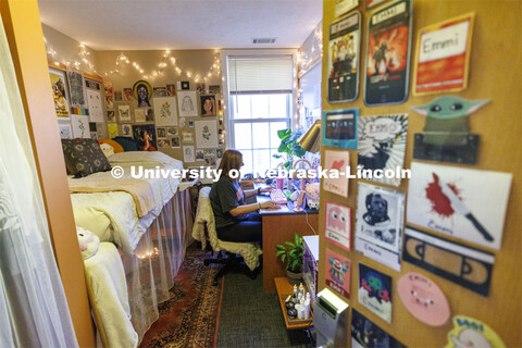 One student studies in their apartment style room. Housing Photo Shoot in The Courtyards Residence H