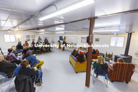 Sophia Perdikaris describes the Reller Praire to a group of counselors. The interior of the metal bu