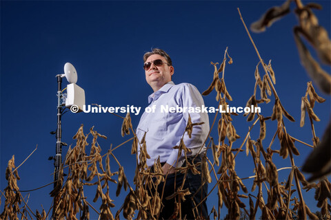 Mehmet Can Vuran lead member of the Field-Nets research team poses in a soybean field on east campus