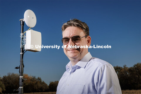 Mehmet Can Vuran lead member of the Field-Nets research team poses in a soybean field on east campus