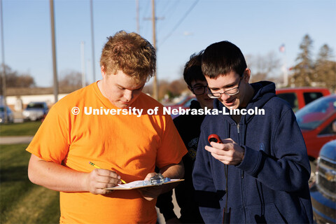 Levi Vaughan, left, and Caleb Rowe measure outdoor weather as part fo the records gathered for their