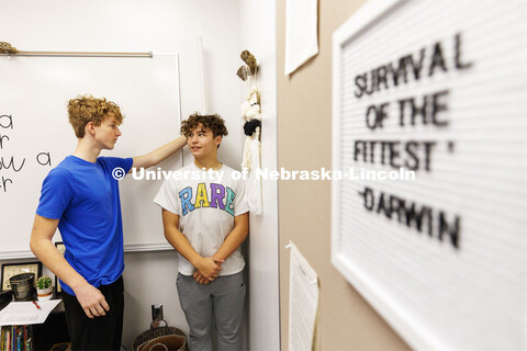 Jack Avila measures the height of classmate Bryce Kunz as the groups recorded body mass indexes of e