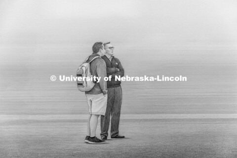 Chancellor Ronnie Green (right) is shown with a student in one area of Souto’s artwork.  Francisco