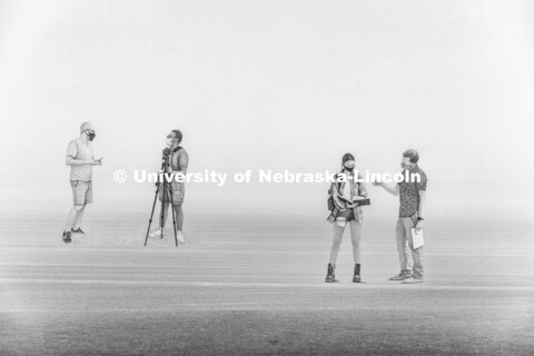 Professors Walker Pickering, left, and Ben Evjen work with students in one area of Souto’s artwork