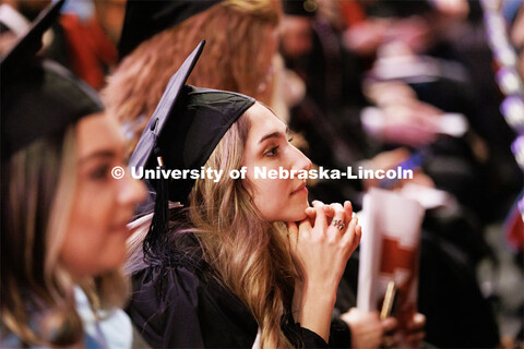 Margarita Shmakova listens to the speakers after receiving her masters degree in Journalism and Mass