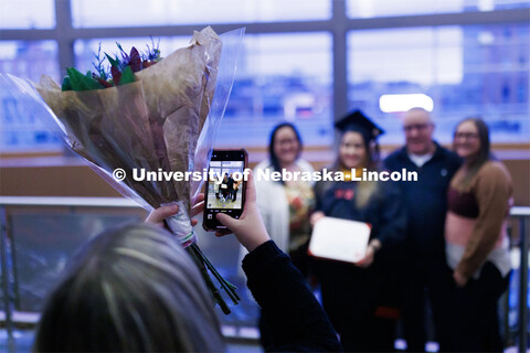 Makayla Burg poses for a photo following Graduate Commencement in Pinnacle Bank Arena. December 16, 