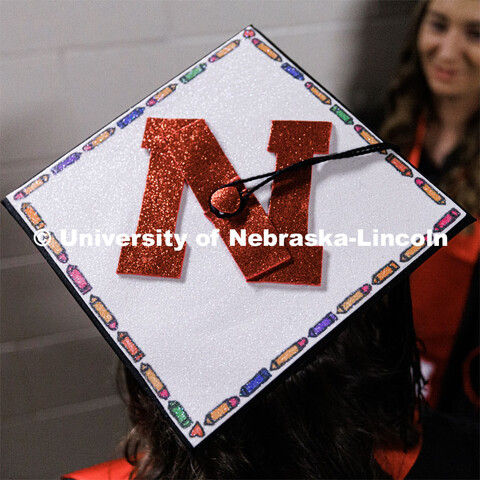 Decorated mortar board. Winter Undergraduate Commencement in Pinnacle Bank Arena. December 17, 2022.