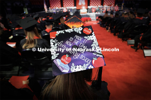 Jordan DeVoogd, a graduate in Elementary Education, models her decorated mortar board. Winter Underg