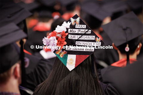 Sandra Ramirezs’ decorated mortar board is dedicated to her parents. It says, “My parents came h