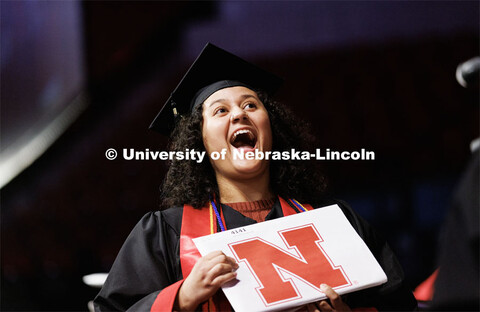 Bella Rodriguez, a graduate in Accounting, smiles for family and friends after receiving her diploma