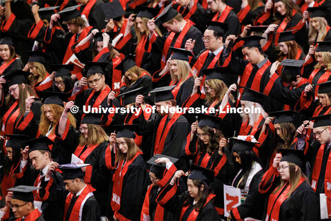 Graduates move their tassels from right to left to signify their graduation. Winter Undergraduate Co