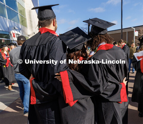 Friends pose for a final photo after commencement. Winter Undergraduate Commencement in Pinnacle Ban