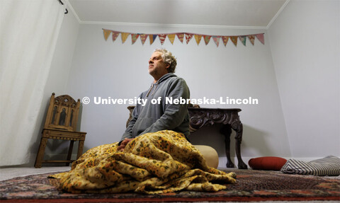 Andy Belser, Dean of the Hixson-Lied College of Fine and Performing Arts, meditates in his Lincoln h