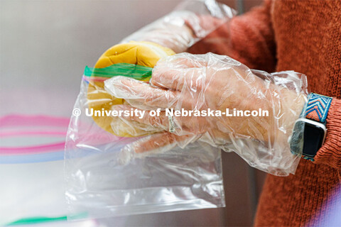 Rebecca Baskerville, Associate Director for Experiential and Global Learning, repackages buns. Nebra
