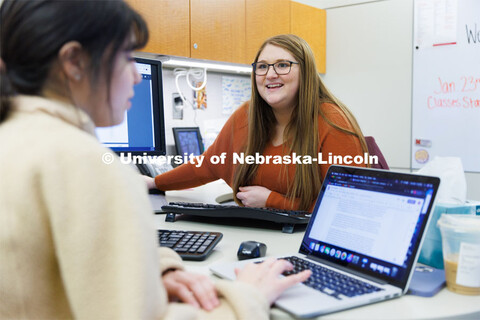 Alex Dudley, an Academic Advisor at the Explore Center helps a student. February 7, 2023. 