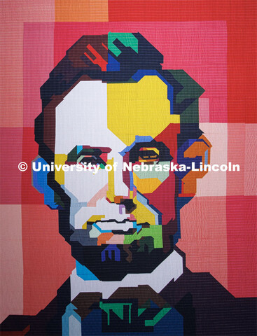 A quilt depicting Abraham Lincoln is on display in the lobby of the Quilt Center. February 8, 2023. 