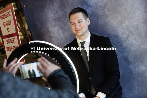 Cameron Spiegel, a sophomore from Omaha, has his photo taken at the Career and Internship Fair in Ne