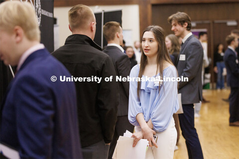 MarryRita Wegener talks with a recruiter at the Career and Internship Fair in the Nebraska Union. Fe