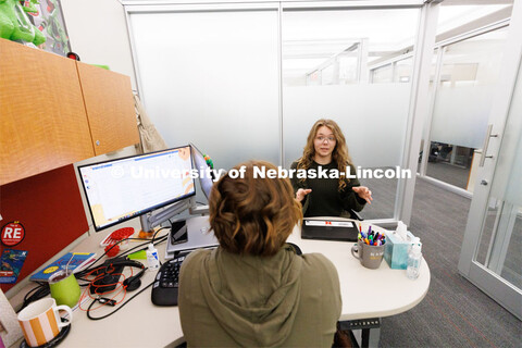 Laura Britten, Academic Navigator works with a student in the Explore Center. Explore Center photo s