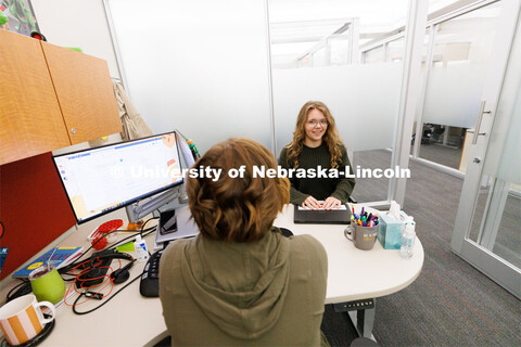 Laura Britten, Academic Navigator works with a student in the Explore Center. Explore Center photo s