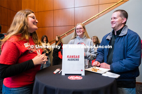 University of Nebraska student representatives speak with out-of-state students and their families d