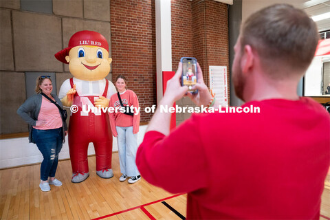 New students get their picture taken with Lil’ Red during Admitted Student Day inside University o