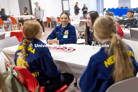 Myesha Larson and Grace Wallerstedt from Oakland-Craig talk with pen pals from McPherson County. FFA