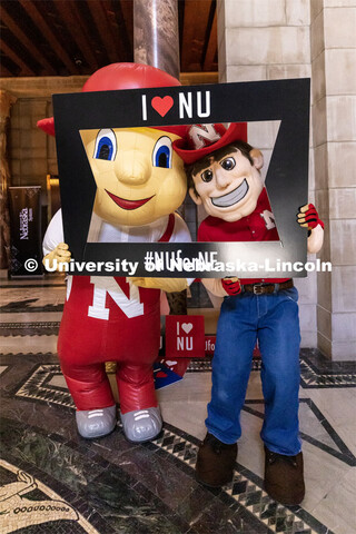 Lil Red and Herbie Husker pose for a photo at the I Love NU day at the State Capitol. April 5, 2023.