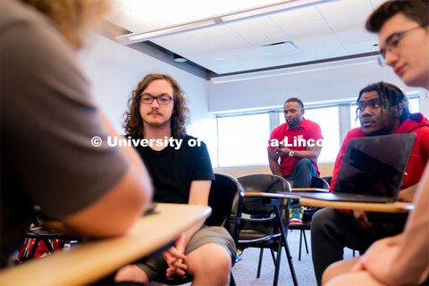 Ahman Green listens as students plan an esports event during his Intro to Esports class in Andersen 