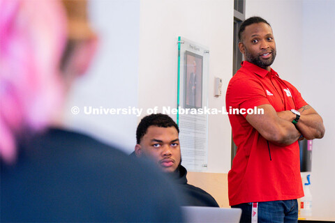 Ahman Green listens as students plan an esports event during his Intro to Esports class in Andersen 