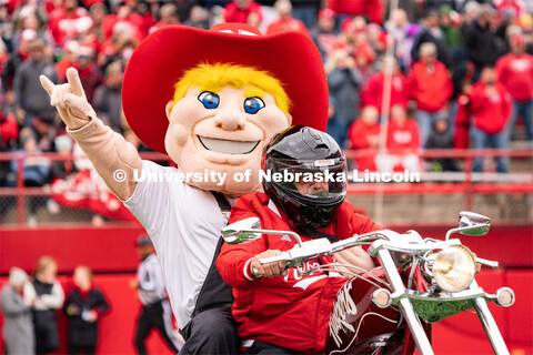 The new iteration of Herbie Husker rides onto the field inside Memorial Stadium before the Husker fo