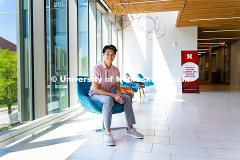 Andre Nguyen, Junior in Nutritional Science and Dietetics, smiles for a photo inside the Gwendolyn A