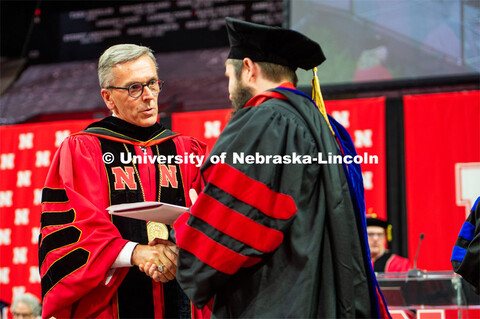 Chancellor Ronnie Green presents dipolomas to the grads. 2023 Spring Graduate Commencement in Bob De