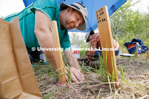 Kyle Flammang, a senior in geography, works on his dig area. LuAnn Wandsnider is leading anthropolog