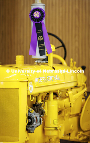 A yellow International tractor wins a purple ribbon at the 4H/FFA Beef Show at the Gage County Fair 