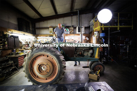 Richard Endacott pulls the battery in the unrestored tractor as they walk through a scene rehearsal.