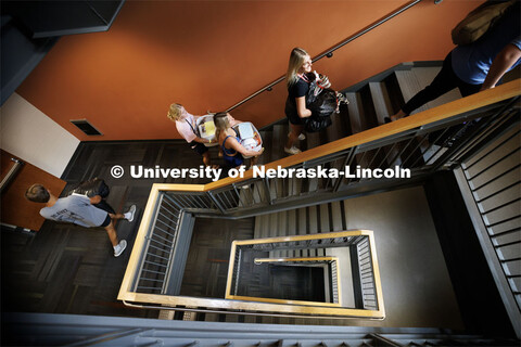 Reese Throener of West Point, Nebraska, leads family and friends with the last of her belongings up 